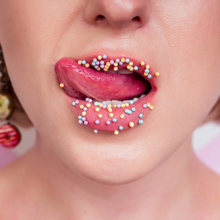 portrait-beautiful-blonde-barbie-woman-perfect-makeup-tongue-sexy-licking-lip-donuts-earrings